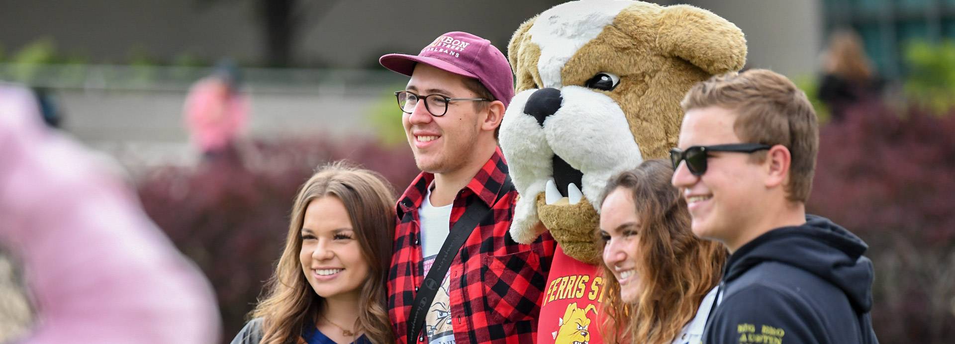 Students posing with Brutus Bulldog, the Ferris mascot