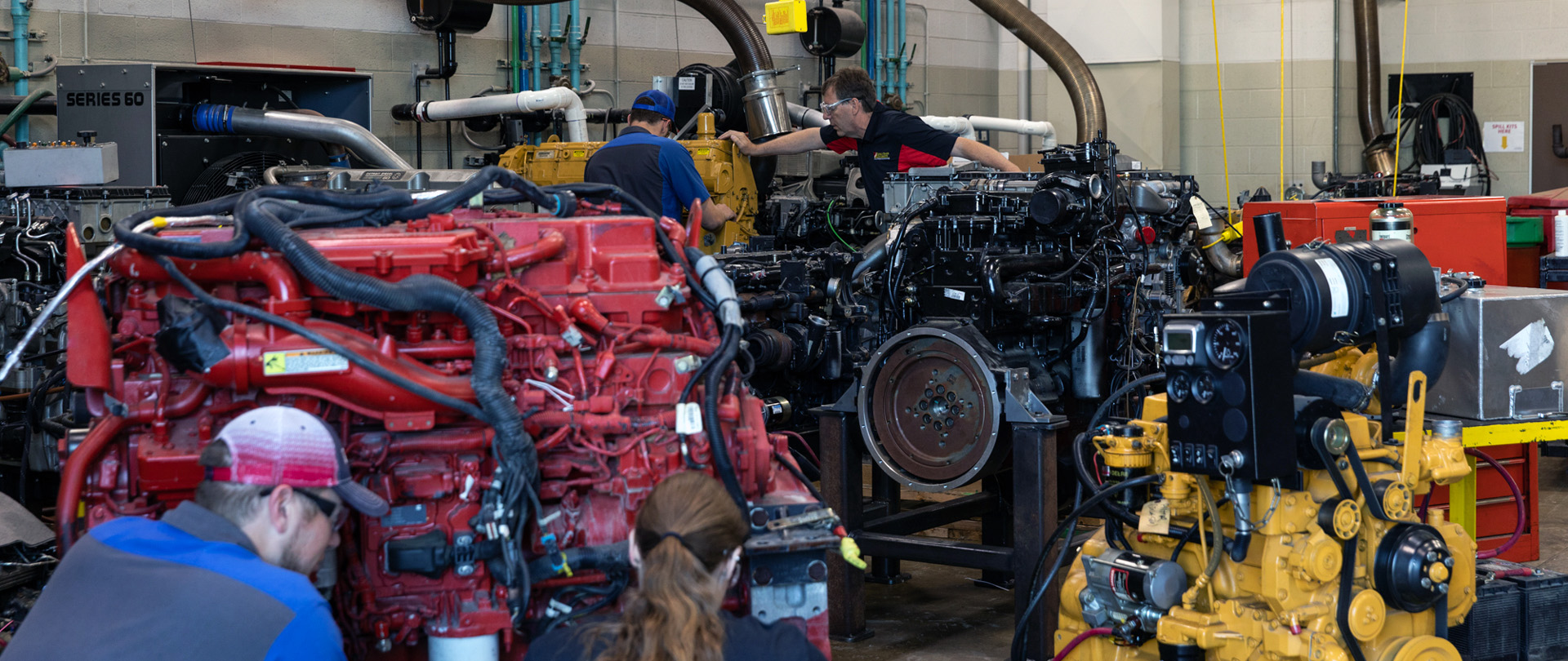 Heavy Equipment students working with diesel engines