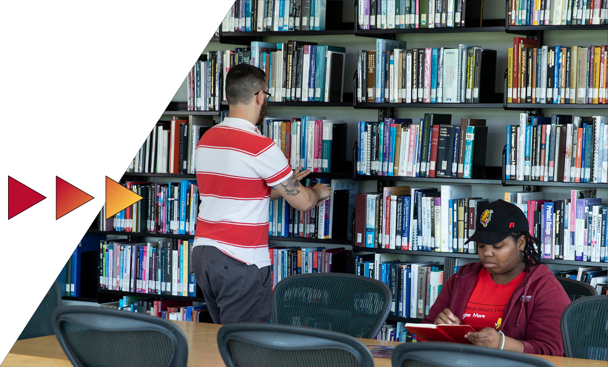 Students in front of a stack of books at the Ferris library.