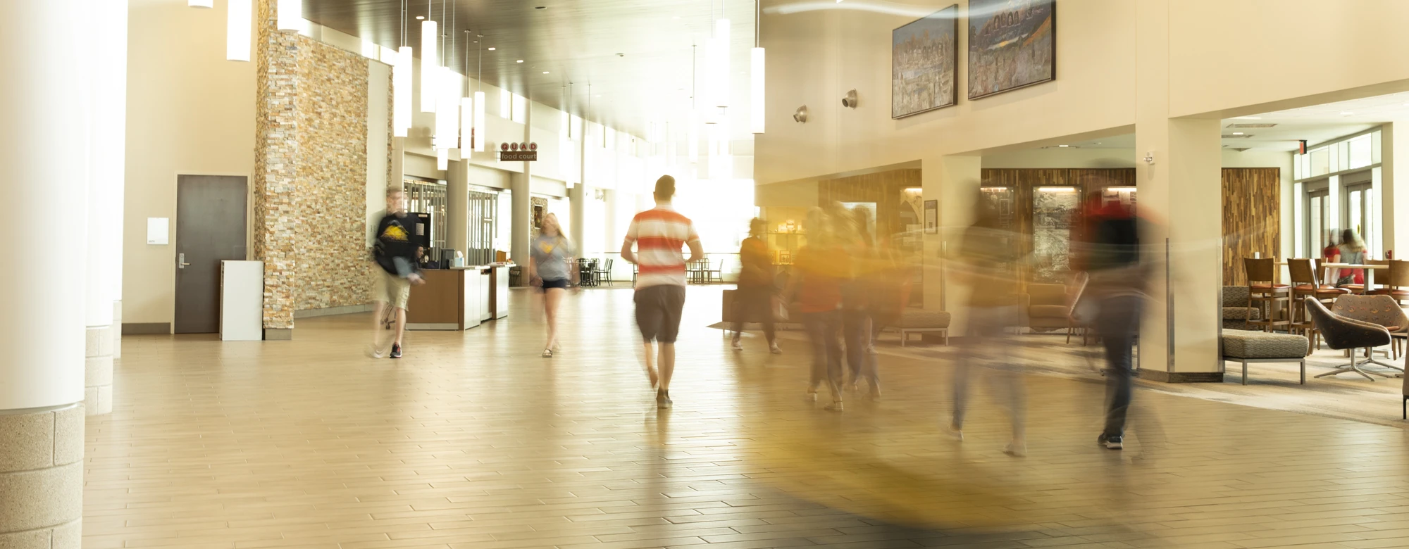 students walking through a campus building