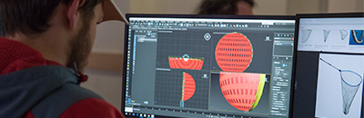 Student working with a game design program