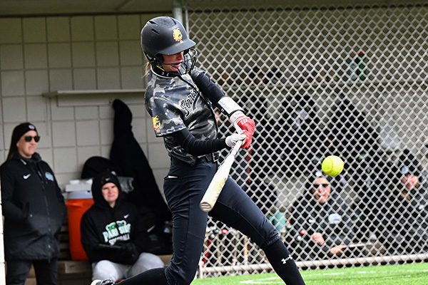 Softball player batting