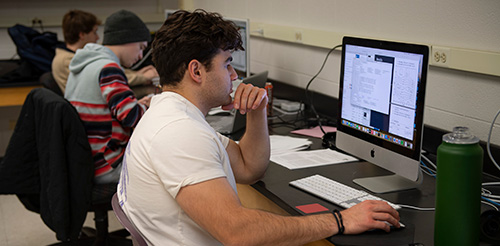 Students posing in a classroom