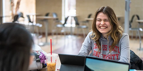 Ferris State University smiling and laughing on campus in Big Rapids MI