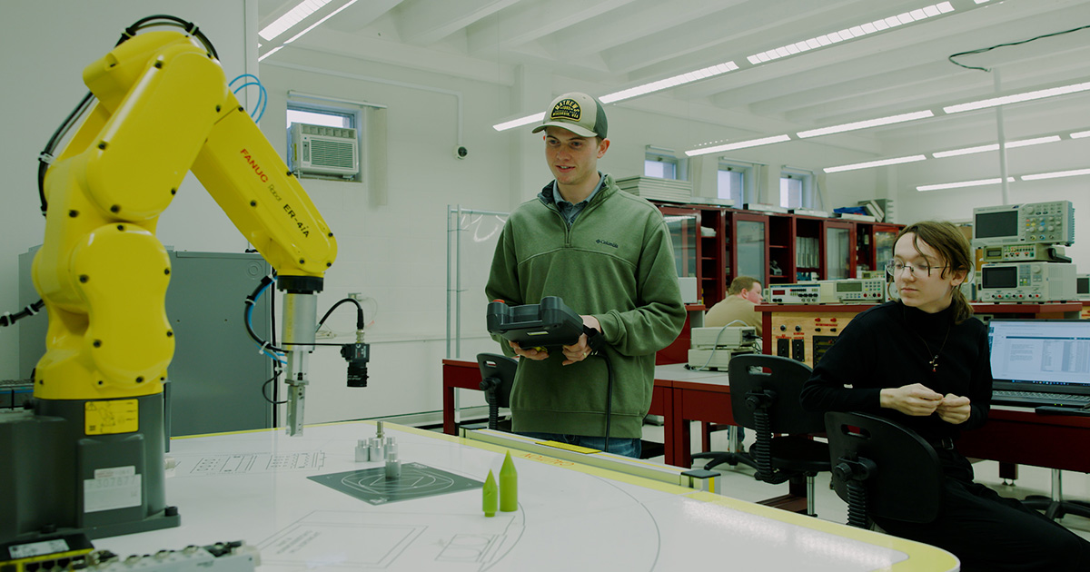 Ferris State University Electronics Automation and Engineering Technology using a remote control to use a robotics arm. Ferris State University Electronics Automation and Engineering Technology using a remote control to use a robotics arm.