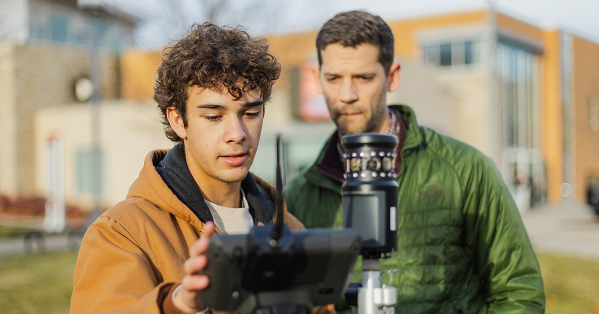Ferris State University Surveying Engineering student and faculty member conducting lab field work.