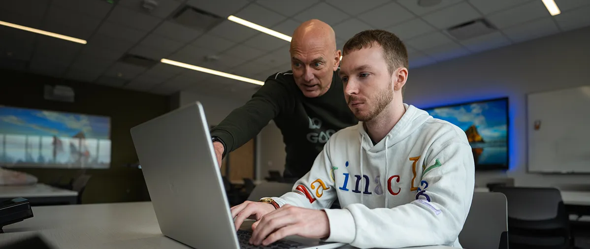 a student studying artificial intelligence with the support of a professor