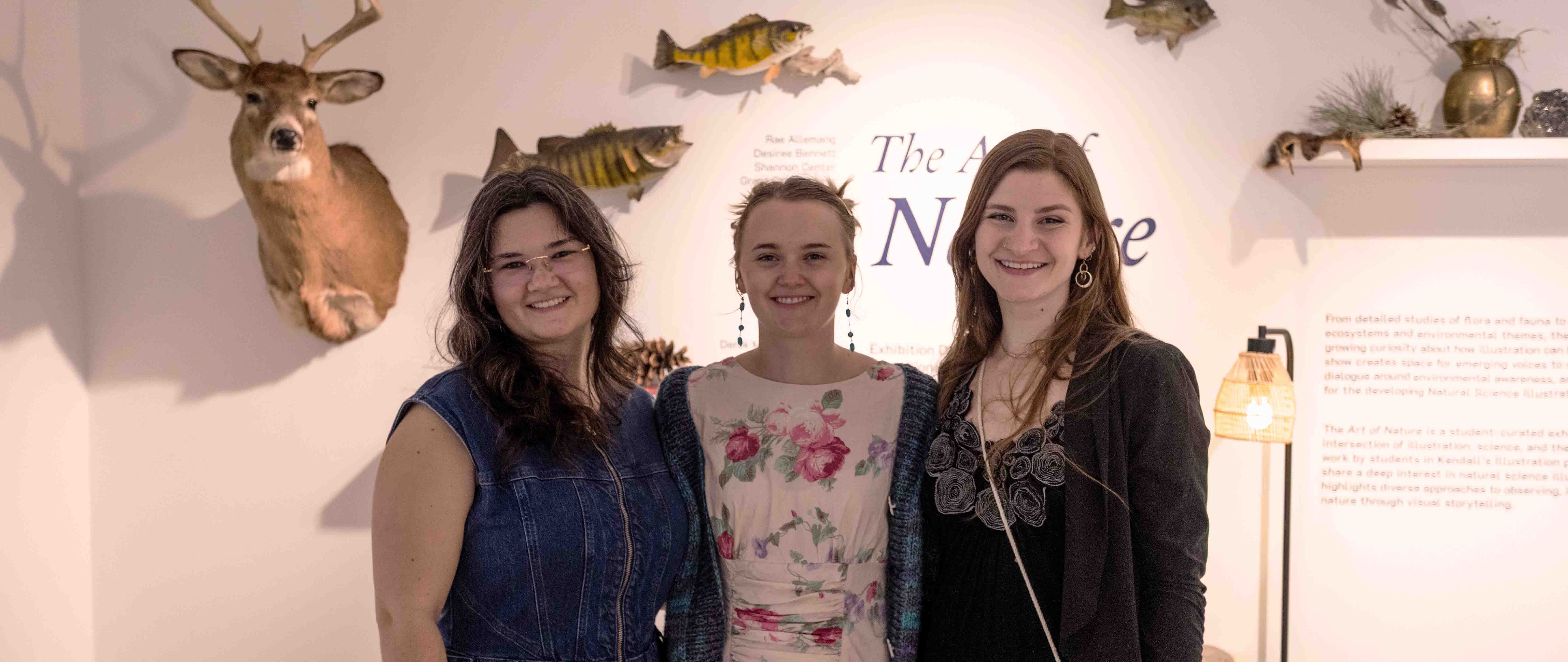The three students who built the gallery exhibition.