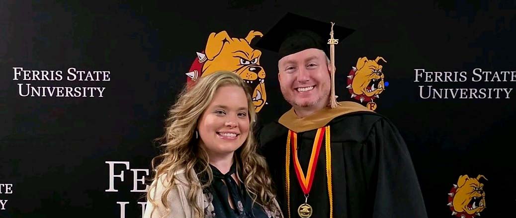 Bovee pictured with his wife after the 2026 commencement