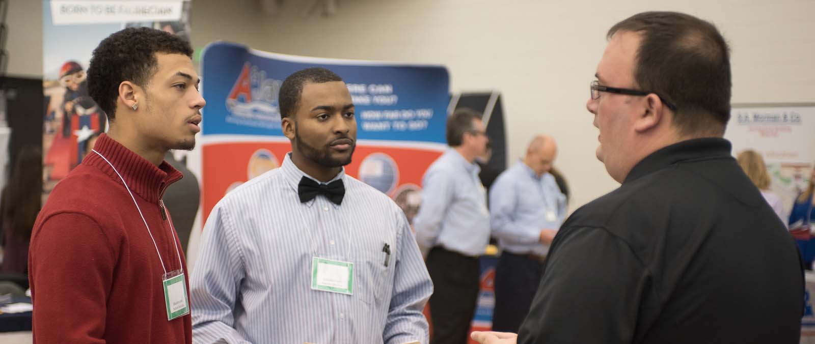 Photo of past students at a career fair