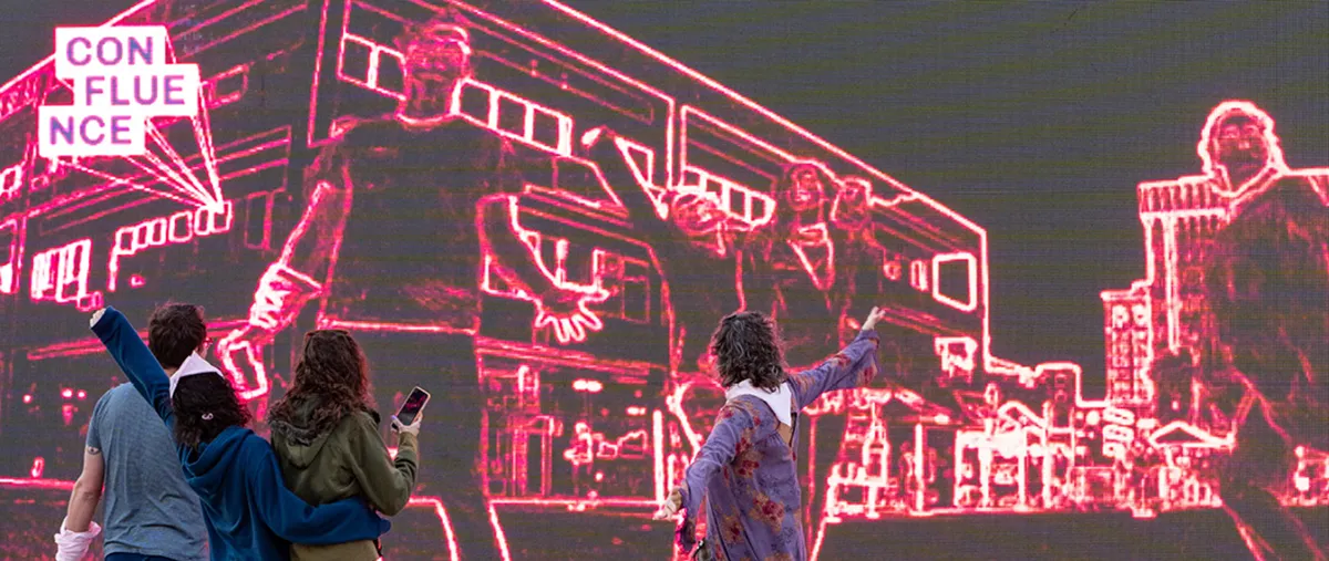 people interacting with a digital exhibit at confluence