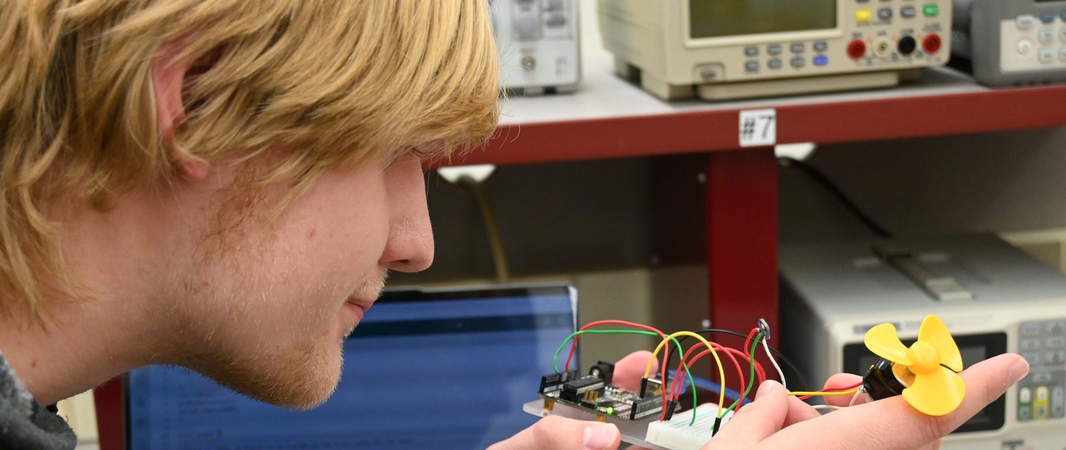 Student working on device during classroom lab