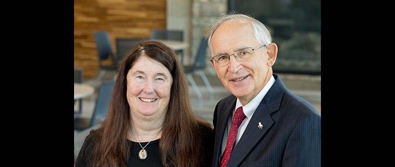 Mr. and Mrs. Eisler posing inside the David Eisler Center in Big Rapids
