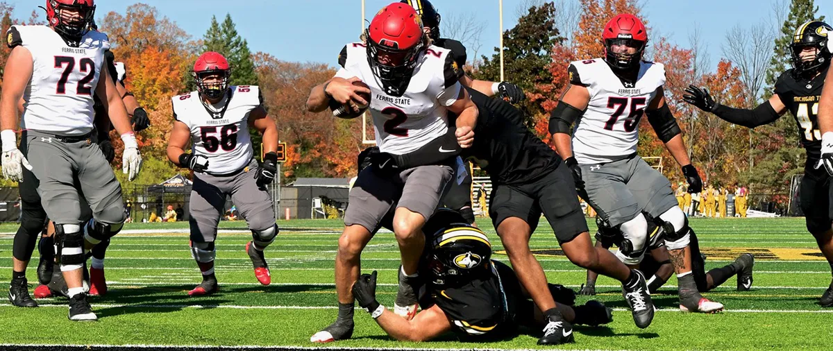 a group of football players at the end zone
