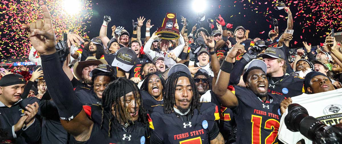 Football team on stage after winning national championship