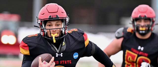 Quarterback Chase Carter running with football