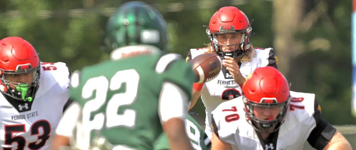 Ferris State quarterback Wyatt Bower takes a snap in Saturday's game against Lake Erie University.