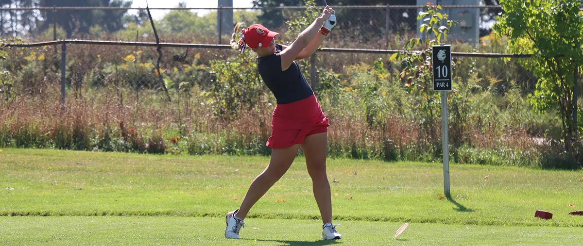 golfer hits a ball