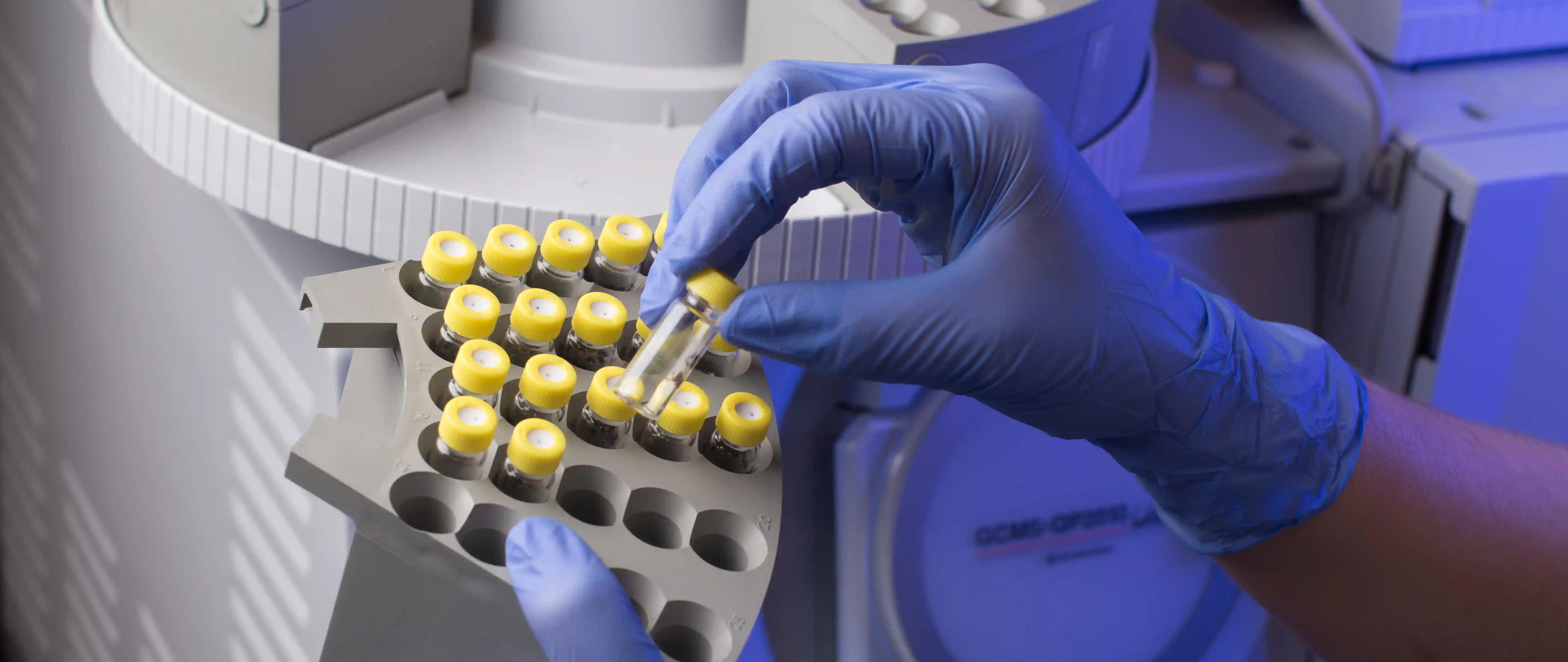 Student inserting test tubes into their case