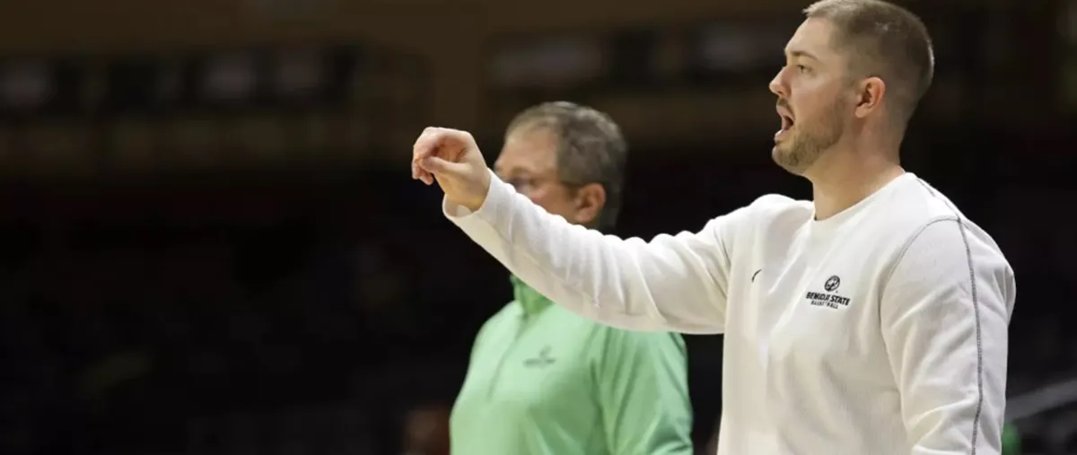 basketball coach coaching his players on the court