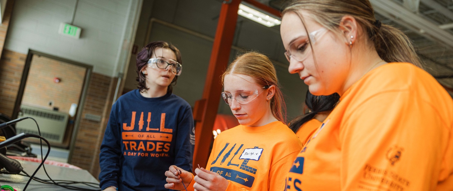 Students getting hands-on with a soldering activity