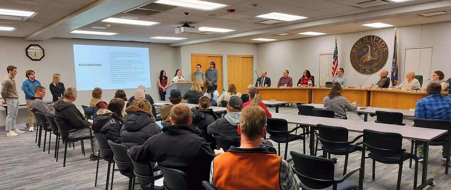 Marketing students presenting their data during a town hall meeting in fall 2025