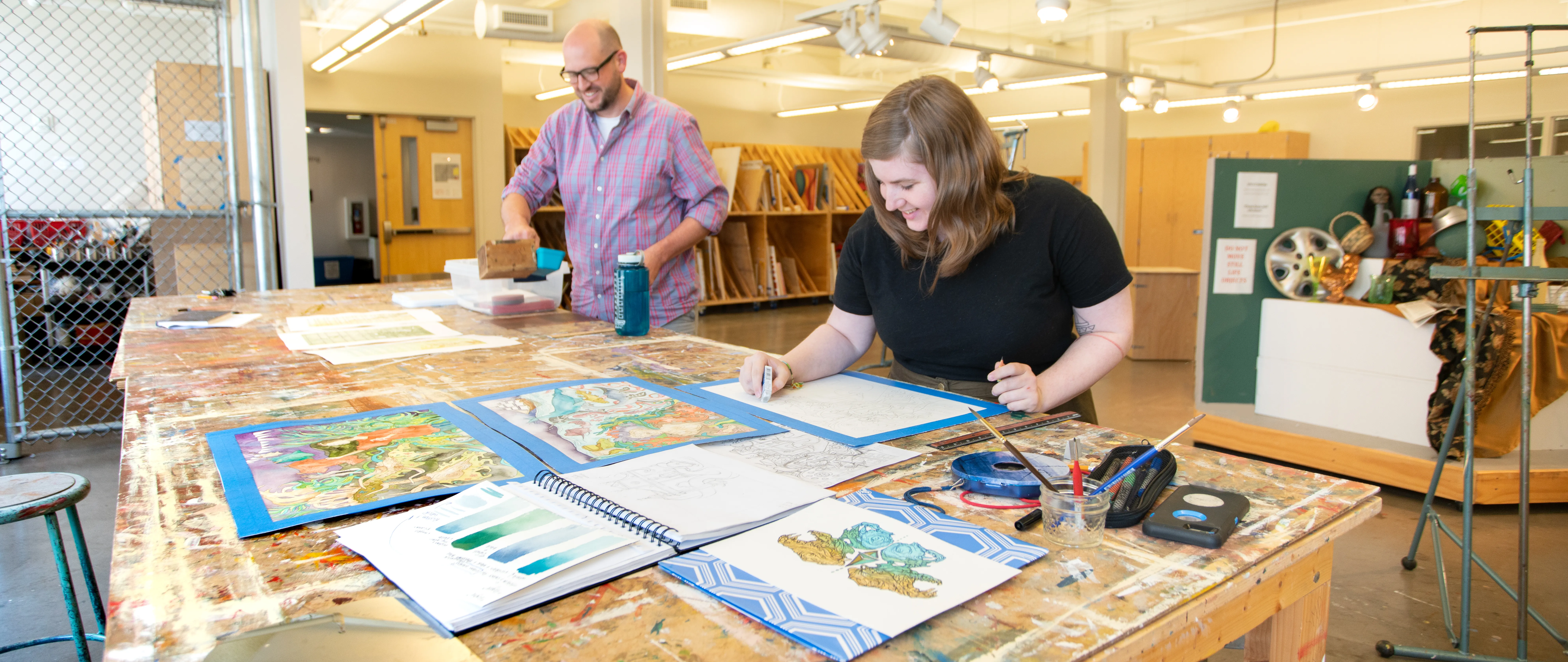 students working in an art studio setting