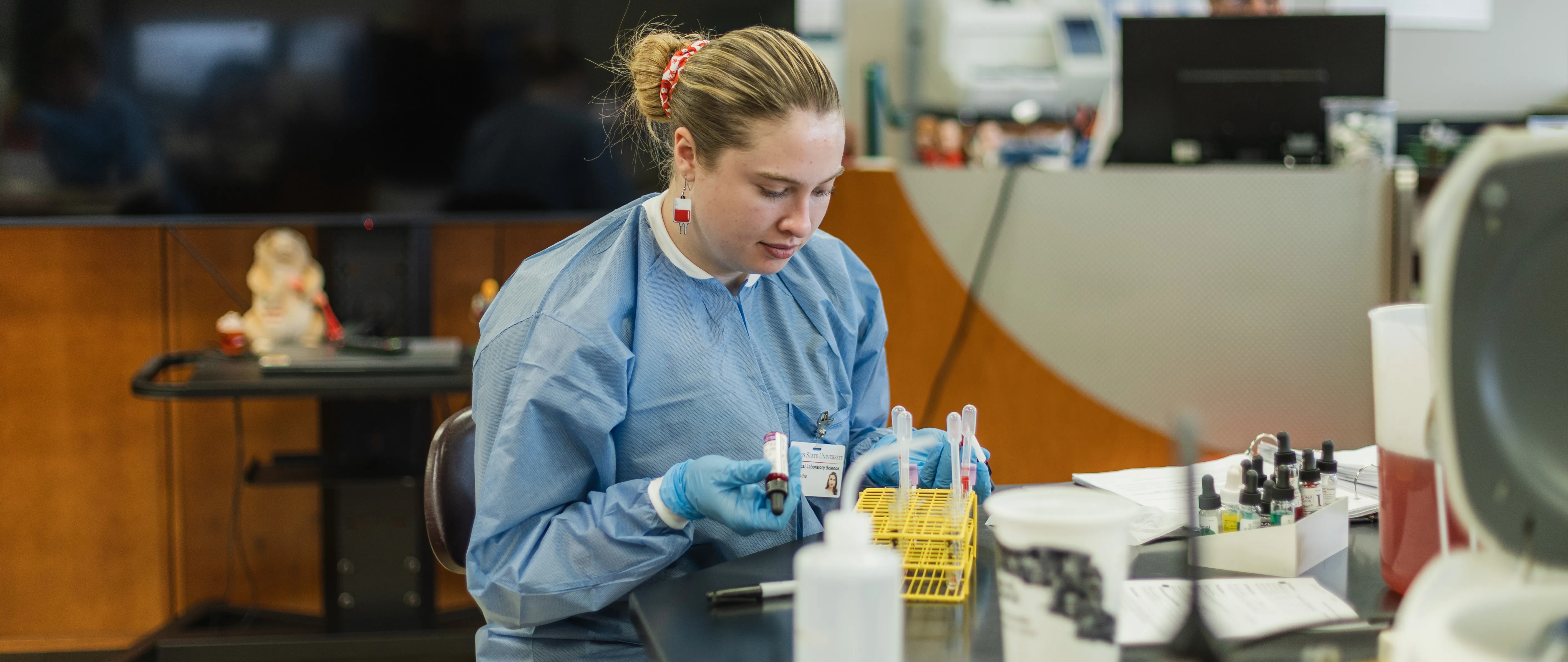 a medical laboratory science student working in a simulated lab environment