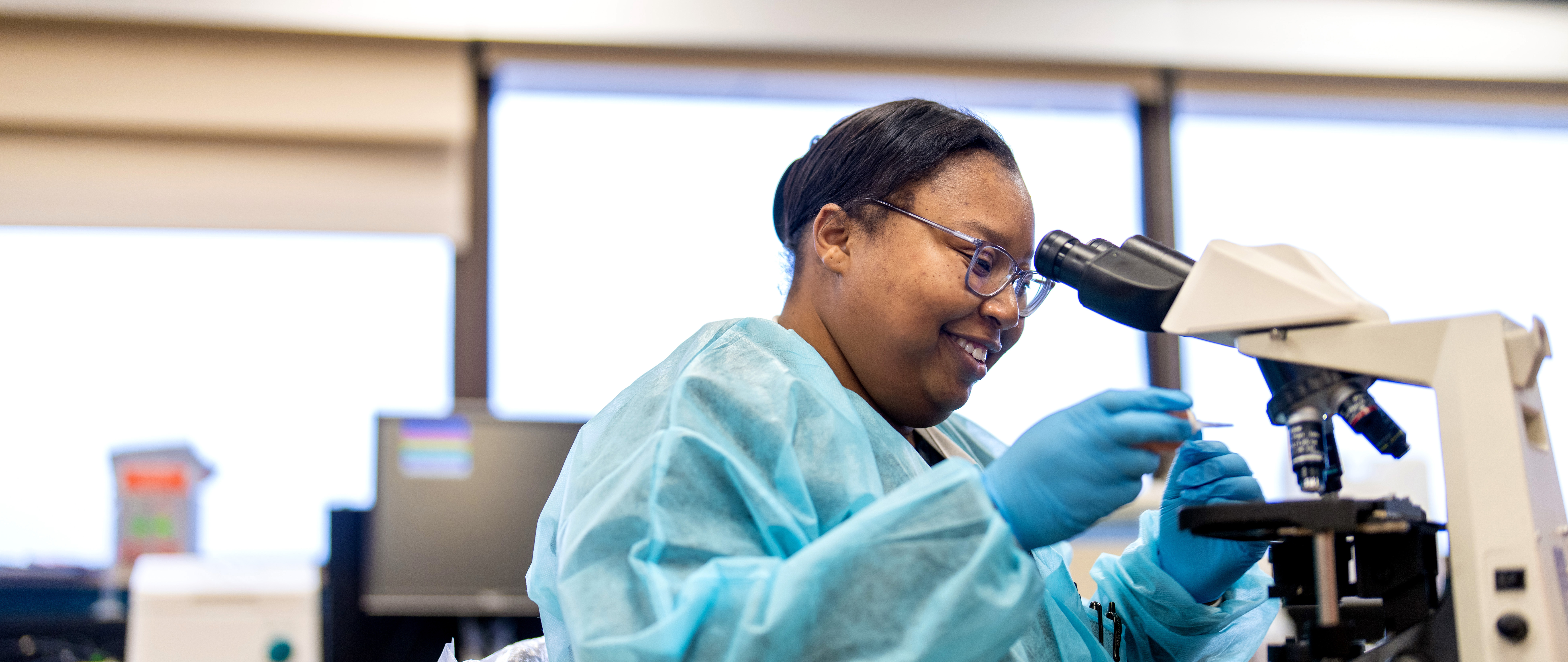 a student with a microscope