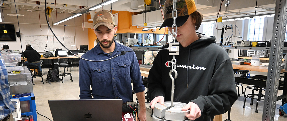 Student with instructor during in-class lab