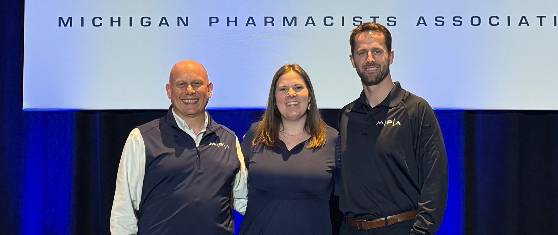 Ferris State University alumni Ryan Bickel, Michelle Kelly, and Ryan Greenley at a Michigan Pharmacists Association event.
