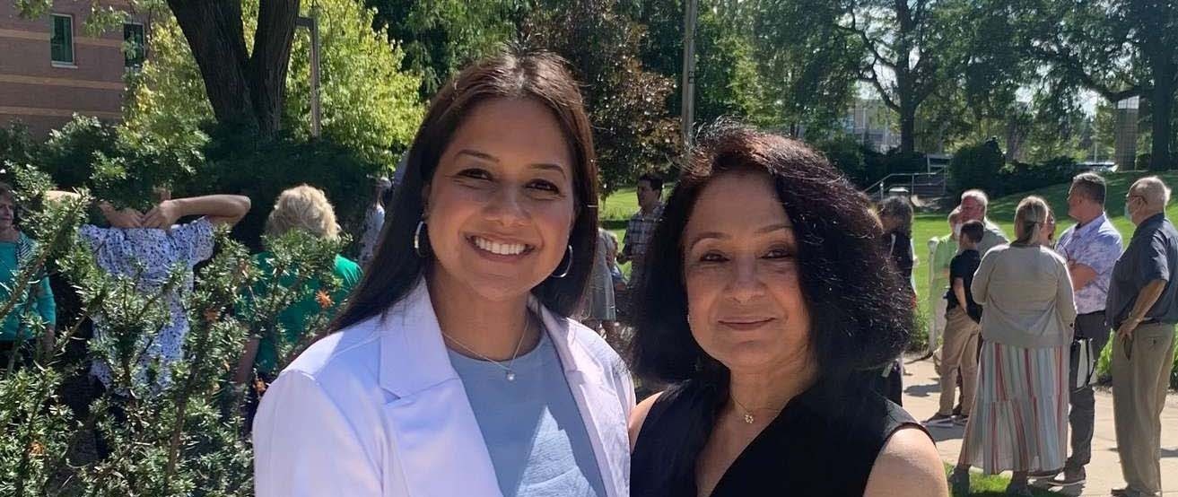 Tiasha Nandi standing with her mother