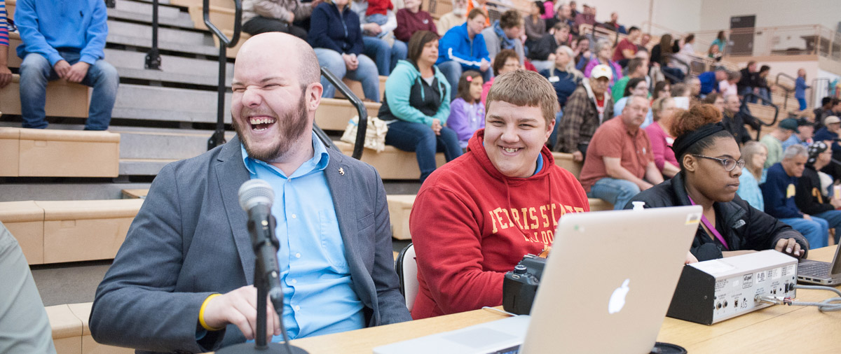 student announcers at a basketball game