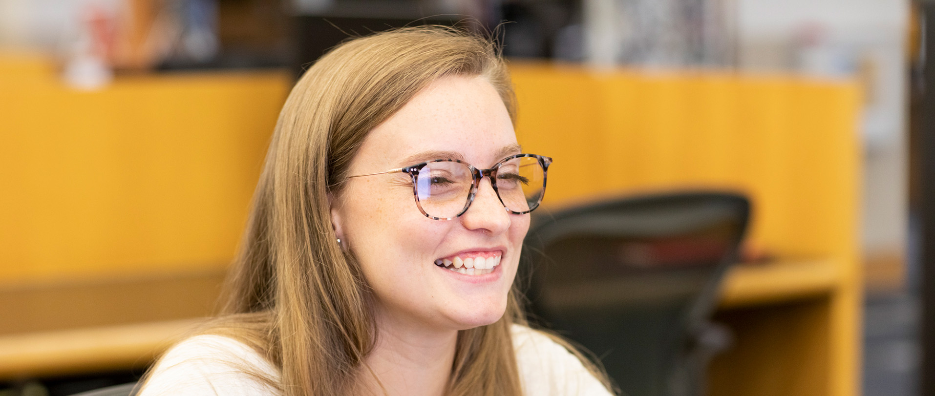 Student with glasses on the campus of Ferris State University