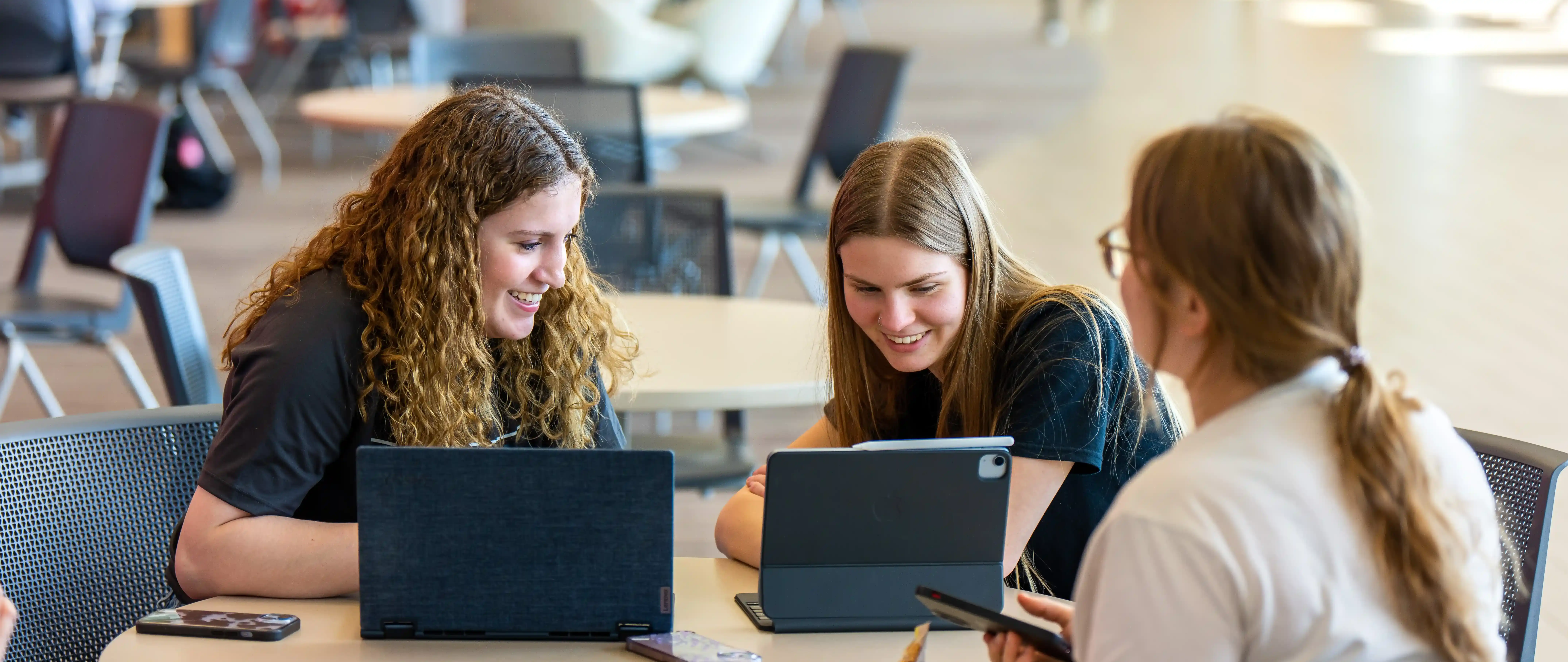 students working around computers together on Ferris State's Big Rapids campus
