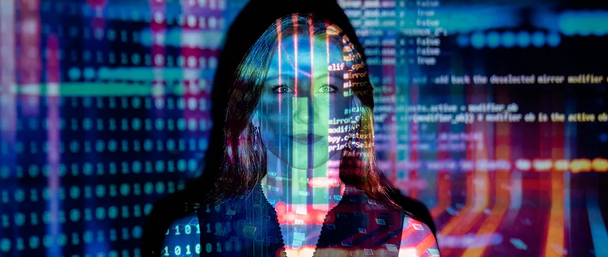 a women standing in front of a screen with text and numbers overlaying on top of her face