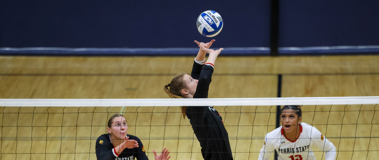 volleyball player jumping to spike the ball