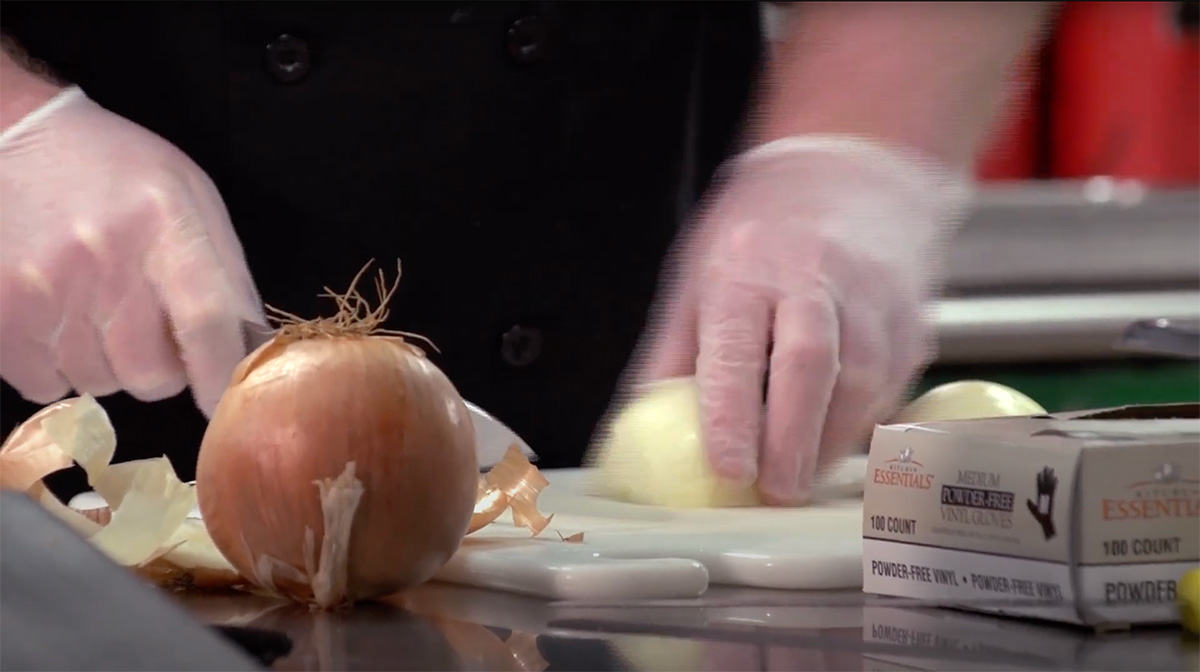 Chef chopping onion