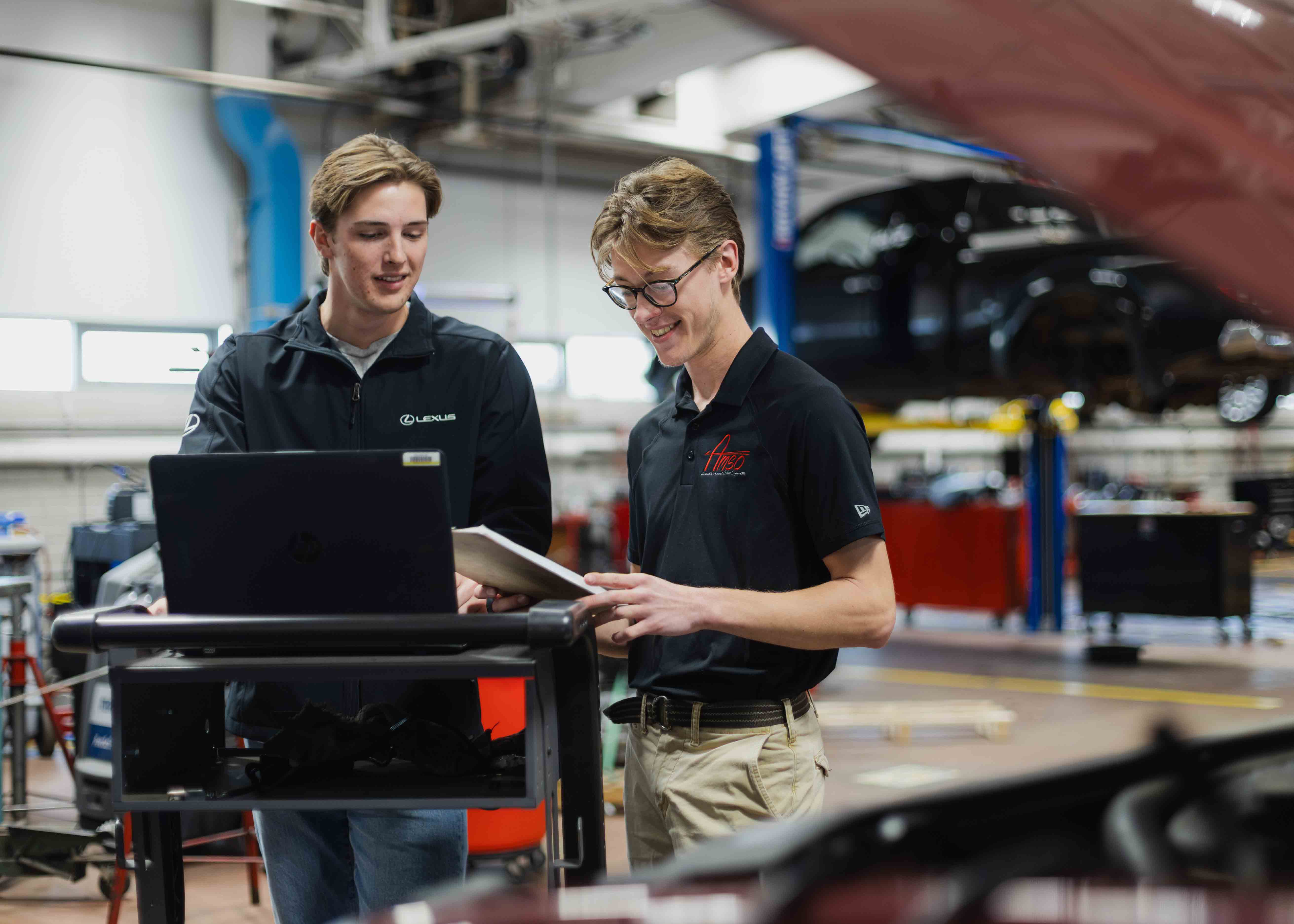 students in an automotive garage
