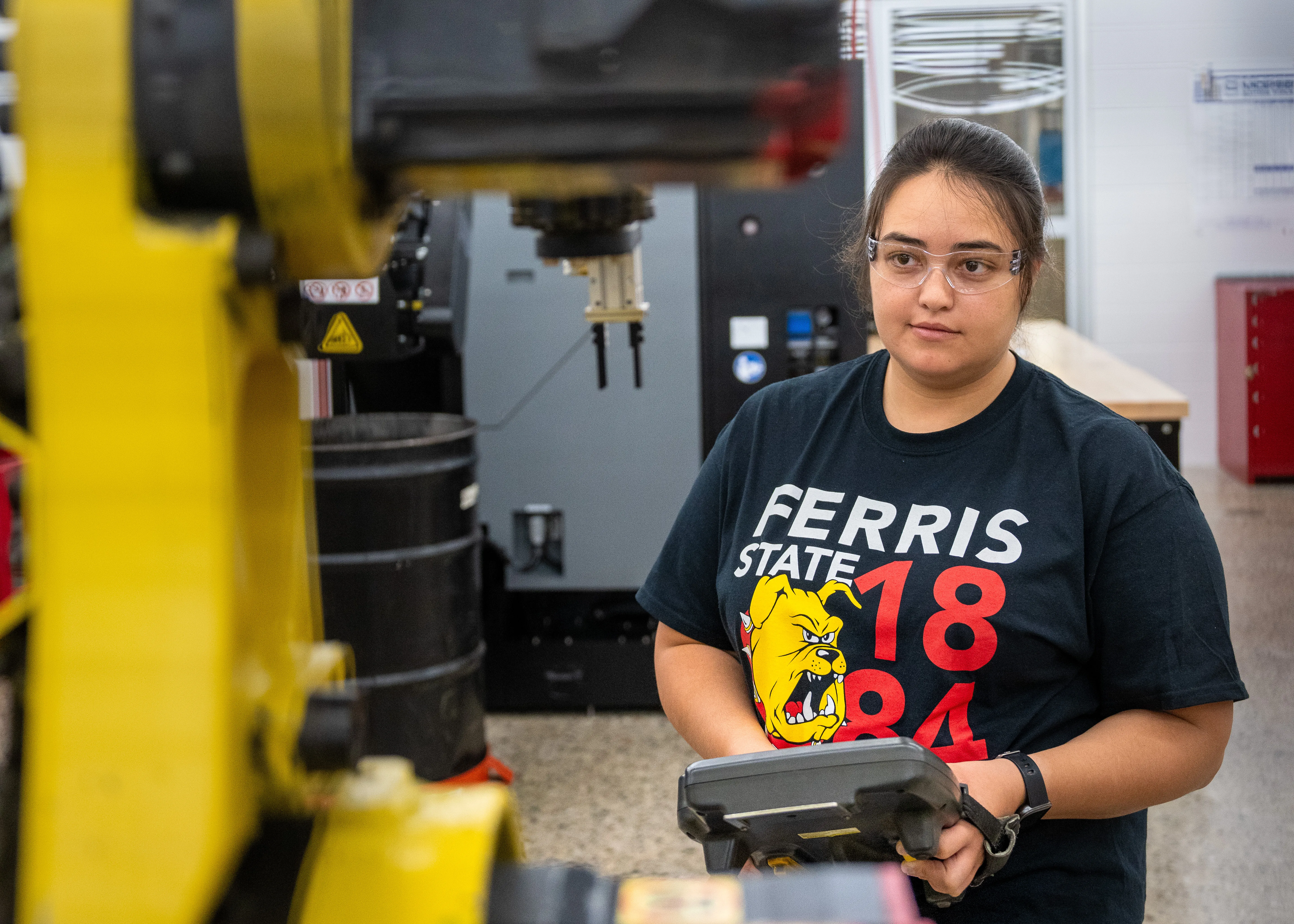student working with a robot