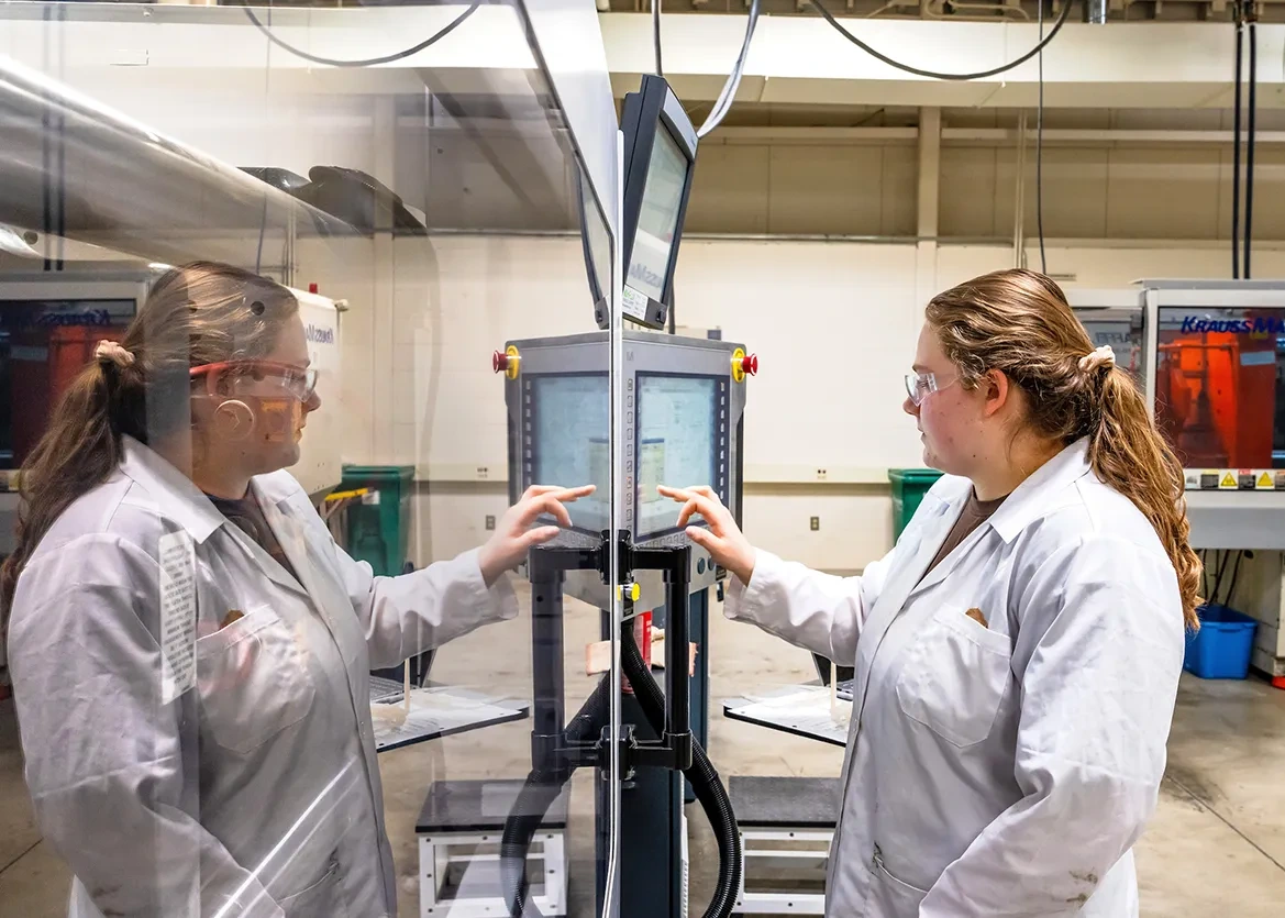 student using a robot