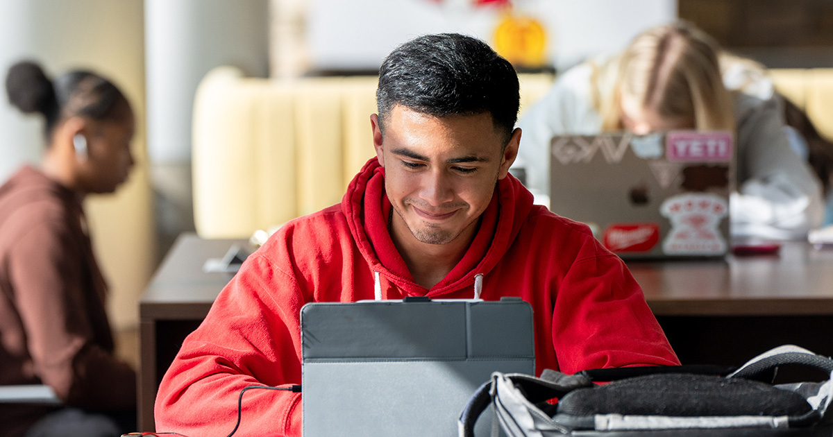 Ferris State University international student studying on a laptop