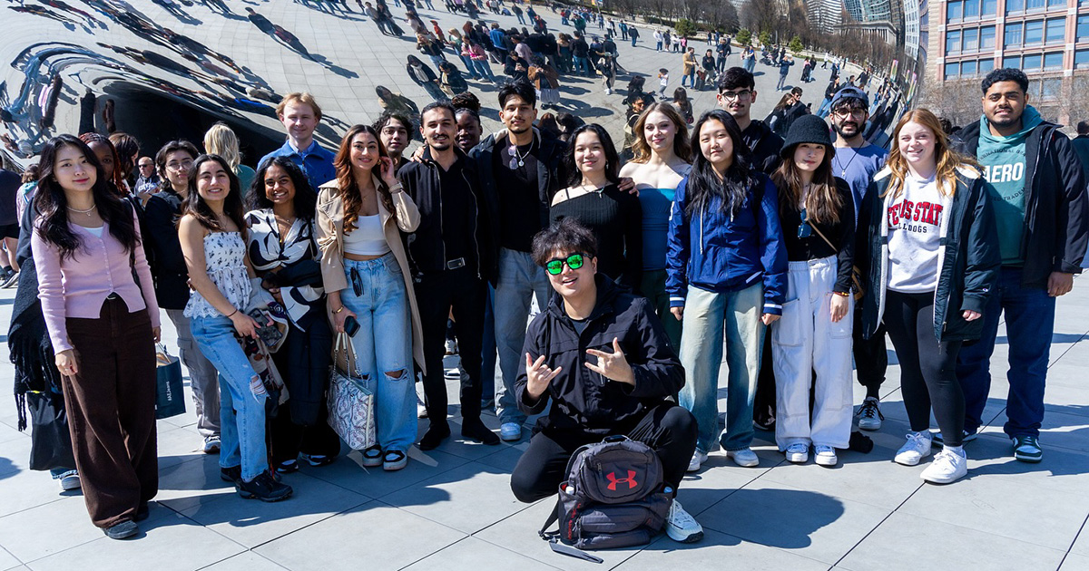 Ferris State University international students standing by the Chicago Bean.