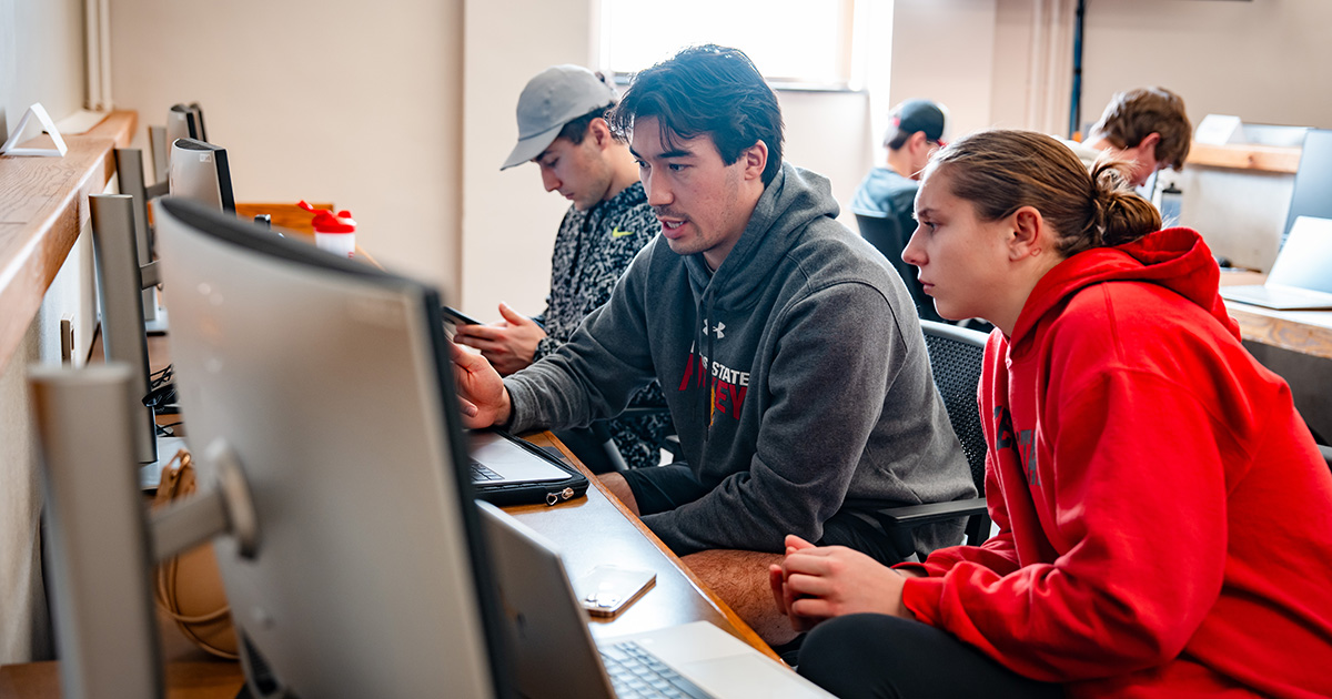Ferris State University international students studying in a computer lab.