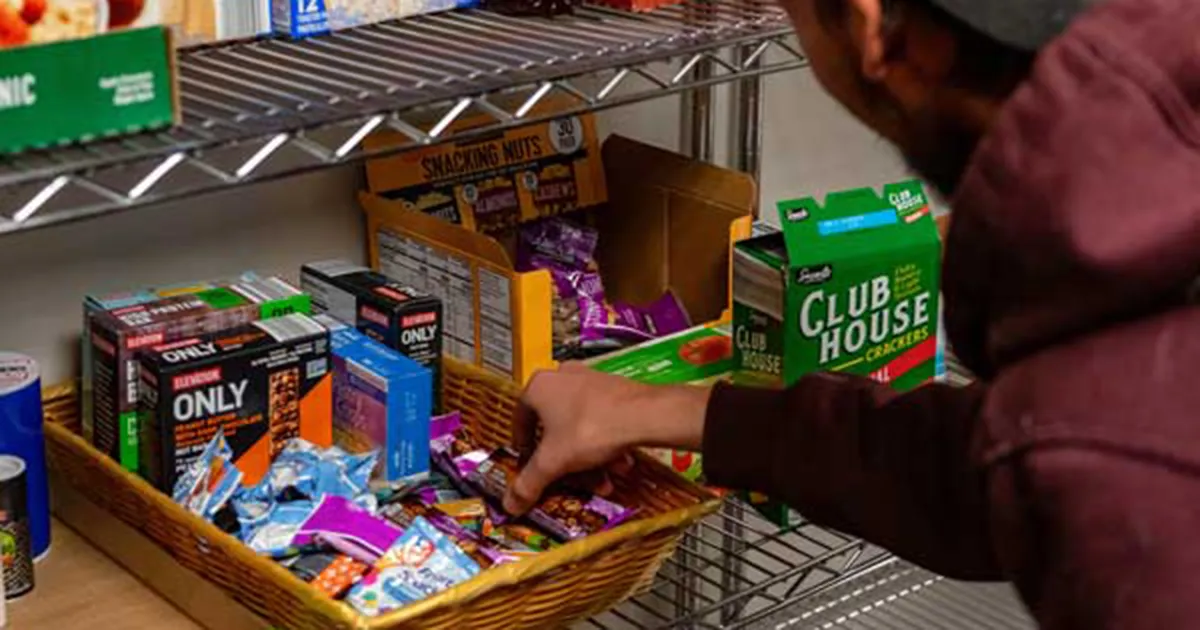 student getting snacks from stash