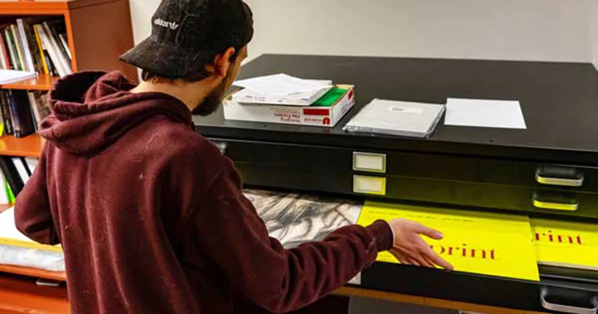 student getting supplies from stash
