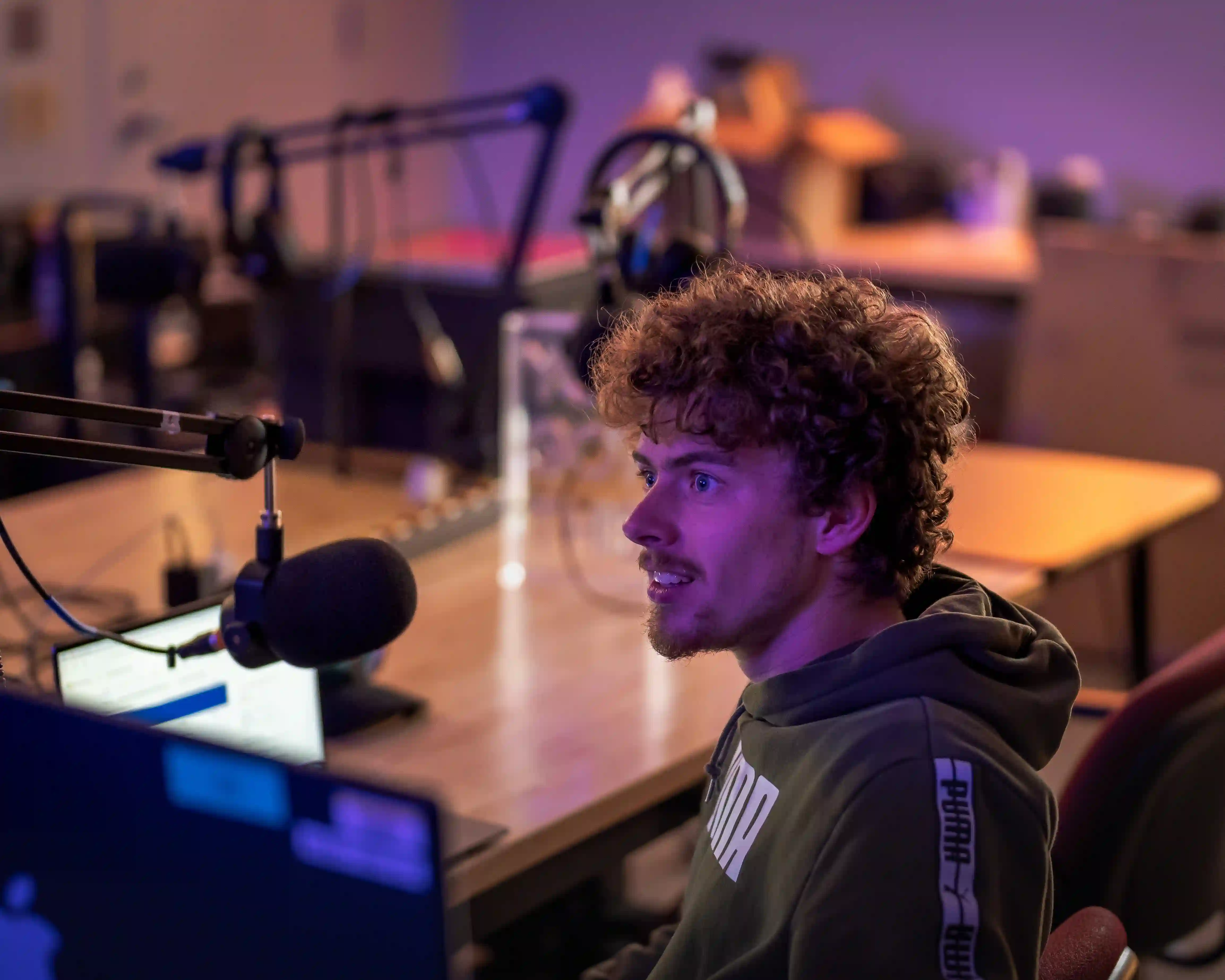 Student talking into a radio microphone.