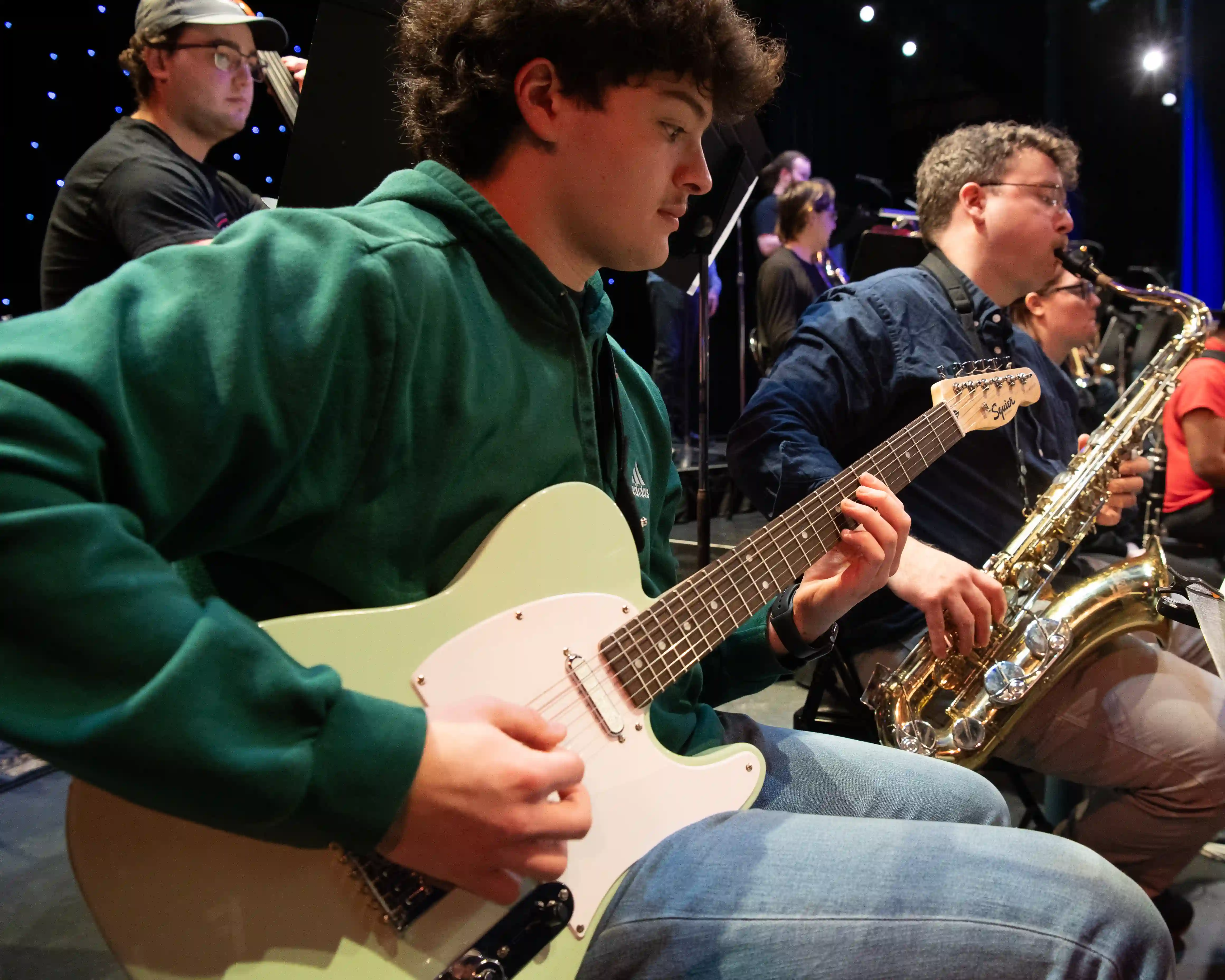 Student playing the electric guitar.