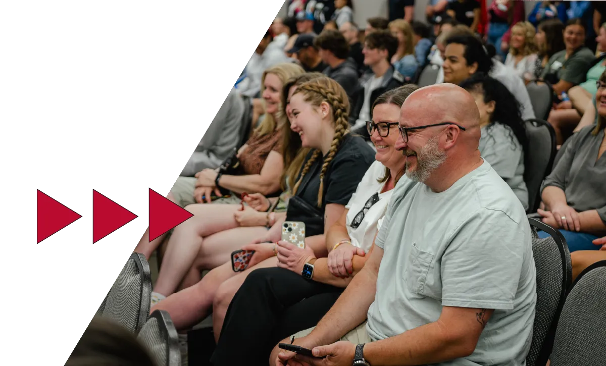 a family sitting in chairs at an admitted student open house