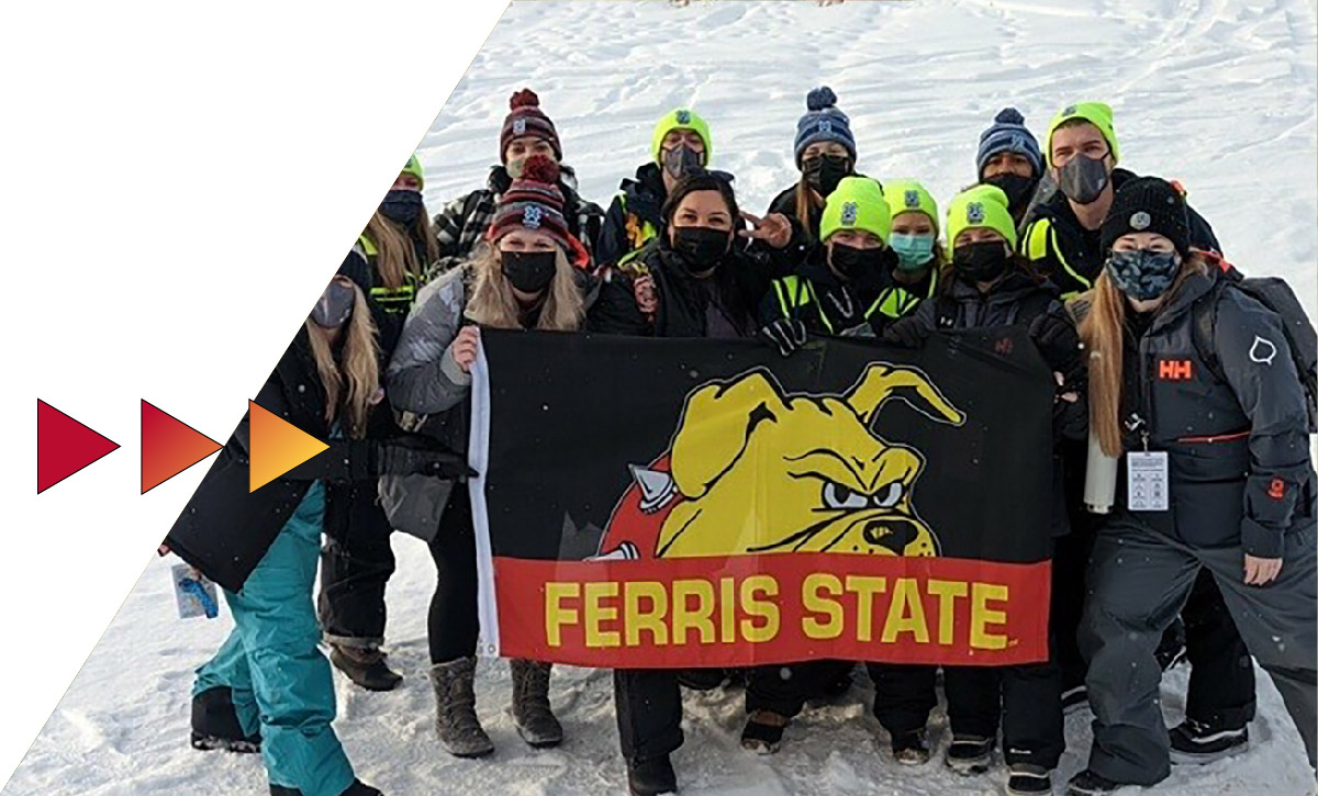 Students holding a Ferris State Bulldog flag at the Winter X-Games